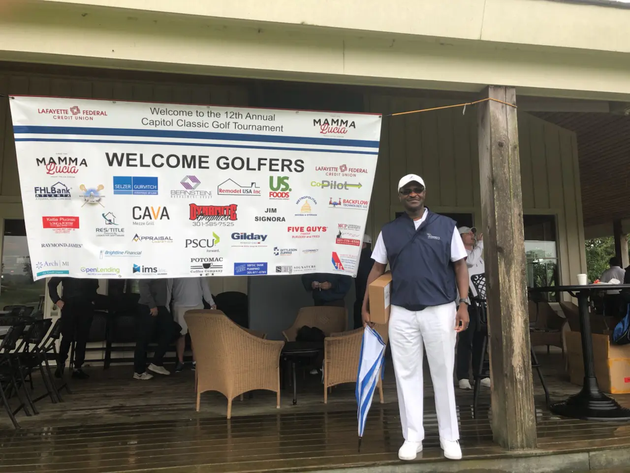 Golf tournament welcome banner and participant