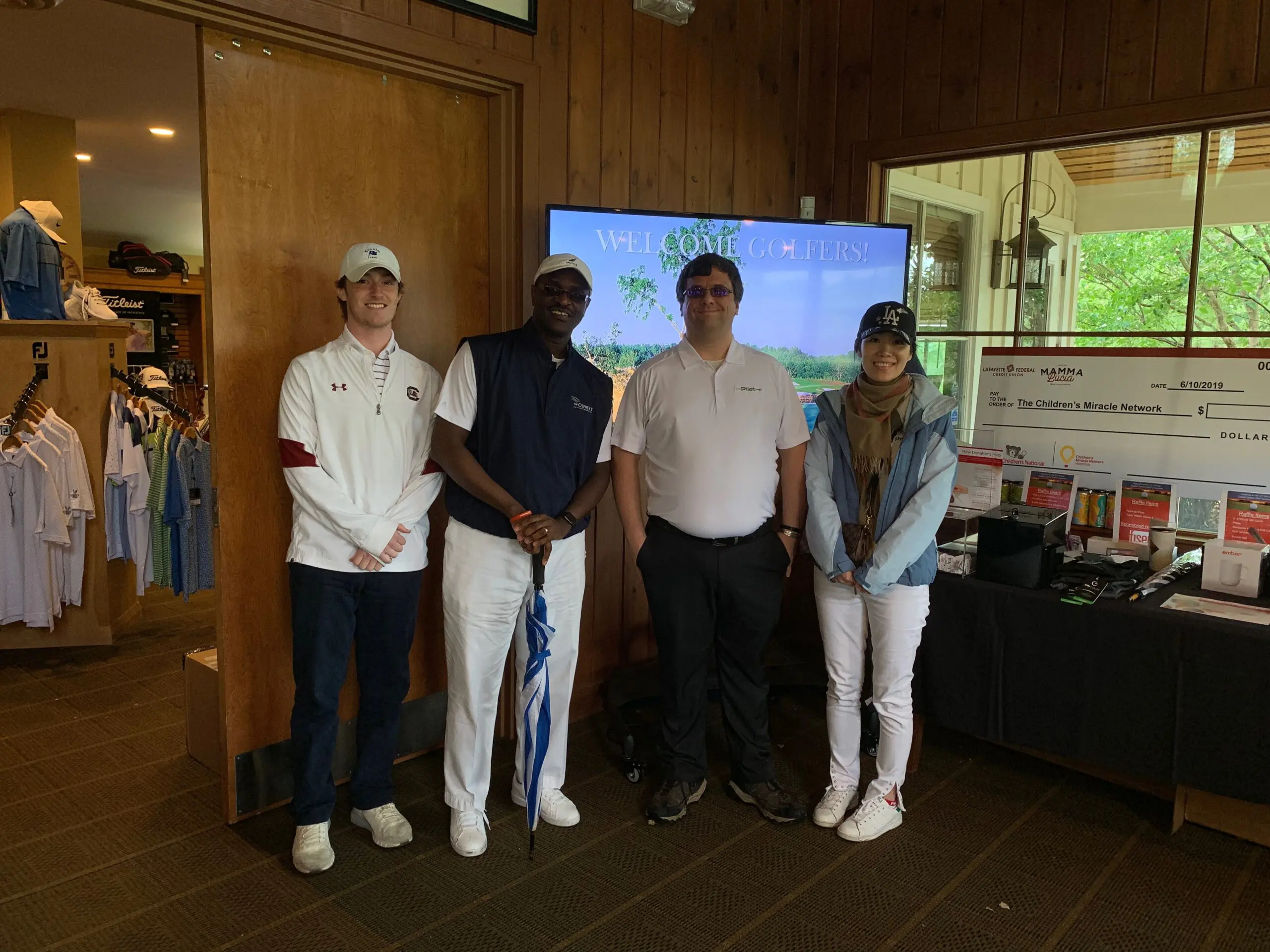 Group posing at a golf event